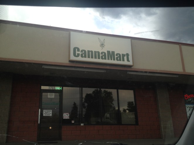 between liquor store and pizza place